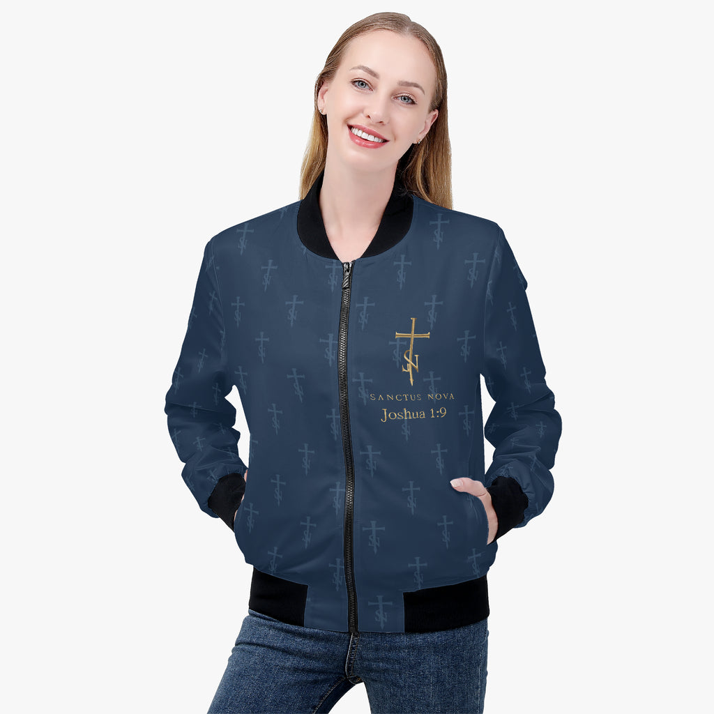 Model with hands in pockets wearing the Royal Navy signature bomber, with gold chest artwork and tonal cross-SN pattern.