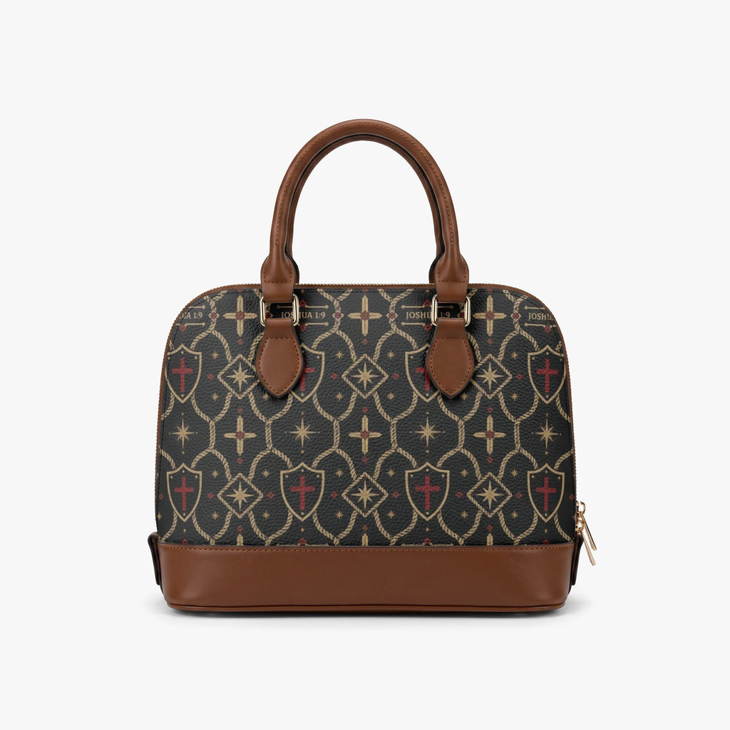 CARRY THE STANDARD dome handbag — SANCTUS NOVA house monogram in gold on charcoal, marked JOSHUA 1:9