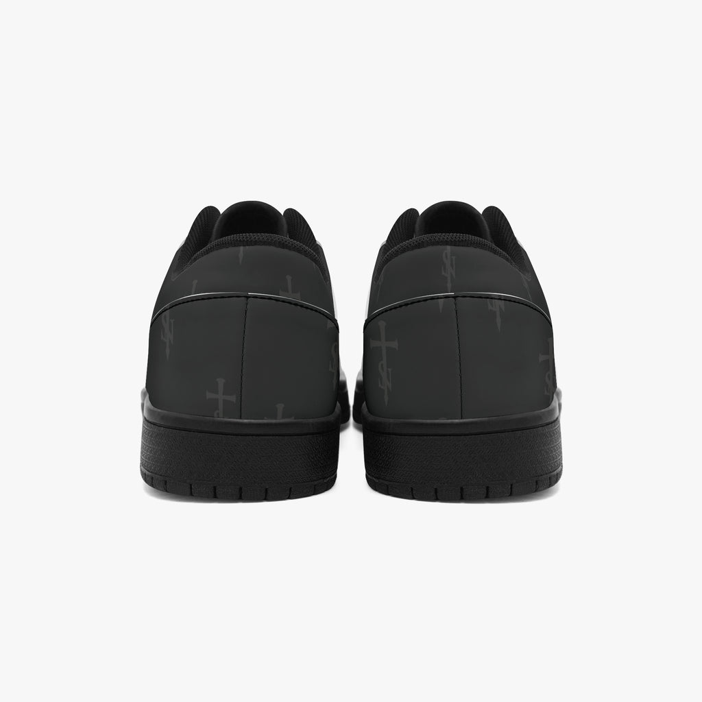 Rear view of SANCTUS NOVA Deep Black sneakers showing the printed heel panels and black soles.