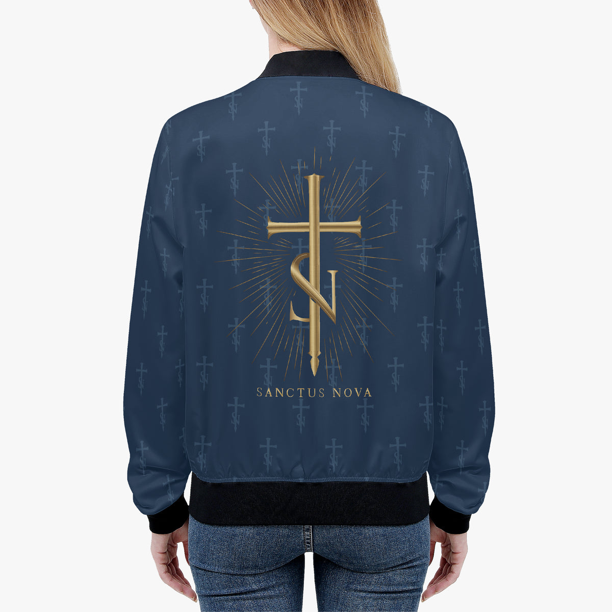 Model wearing the Royal Navy signature bomber from behind, showing the complete gold ray-backed cross-SN and SANCTUS NOVA name.